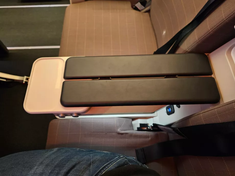 Armrest and storage space