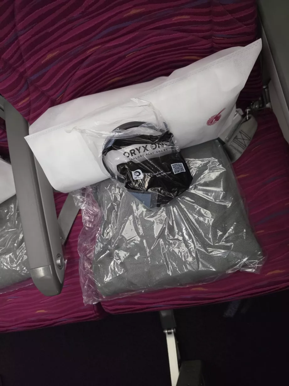 A pillow, a blanket and headphones