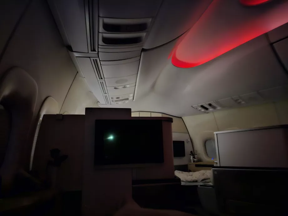 The lamp on the passenger in the row in front of me