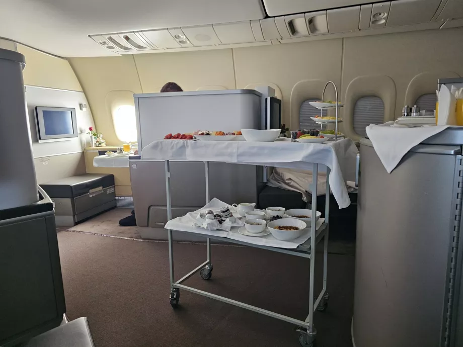 The breakfast table and service going on right next to my seat