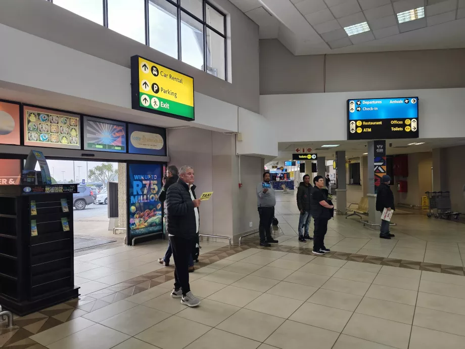 Taxi drivers in the arrivals hall