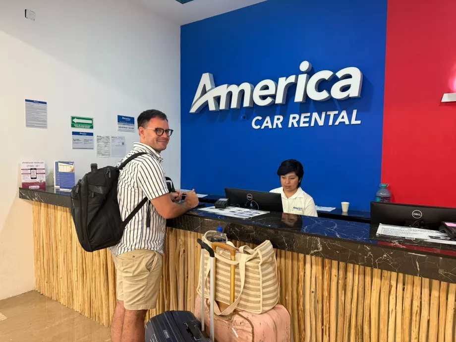Me at the car hire counter in Tulum