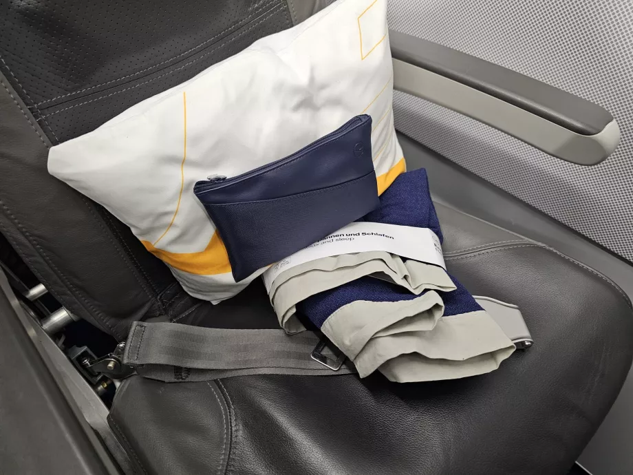 Pillow, amenity kit, blanket