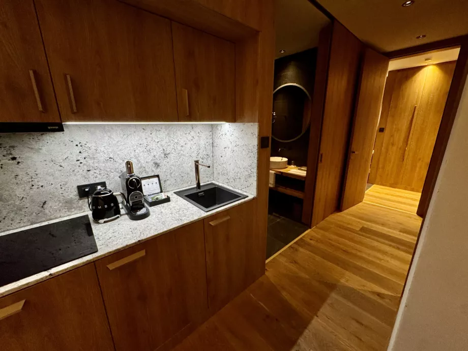 Kitchen and hallway to bathrooms and rooms