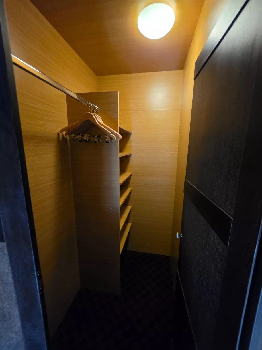 Wardrobe behind the bed