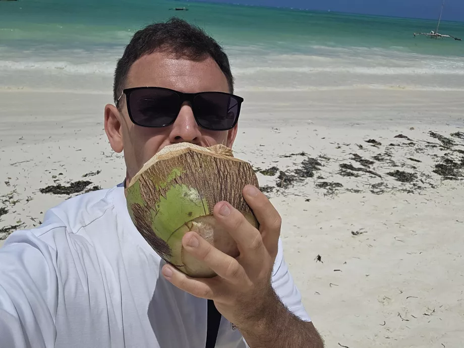 I drink coconut on the beach in Paje