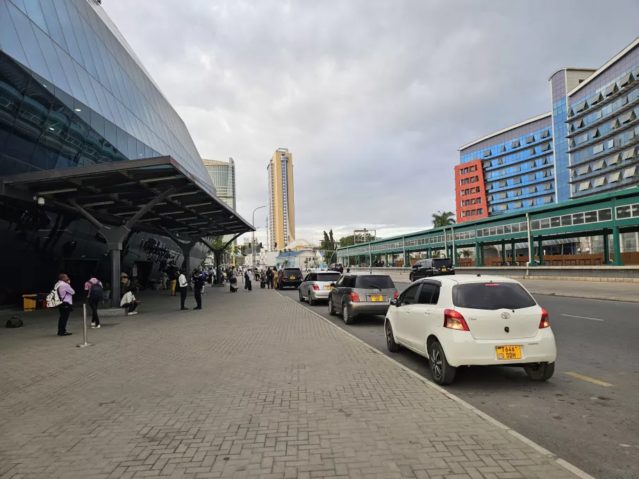 Bolt or Uber cars outside the train station