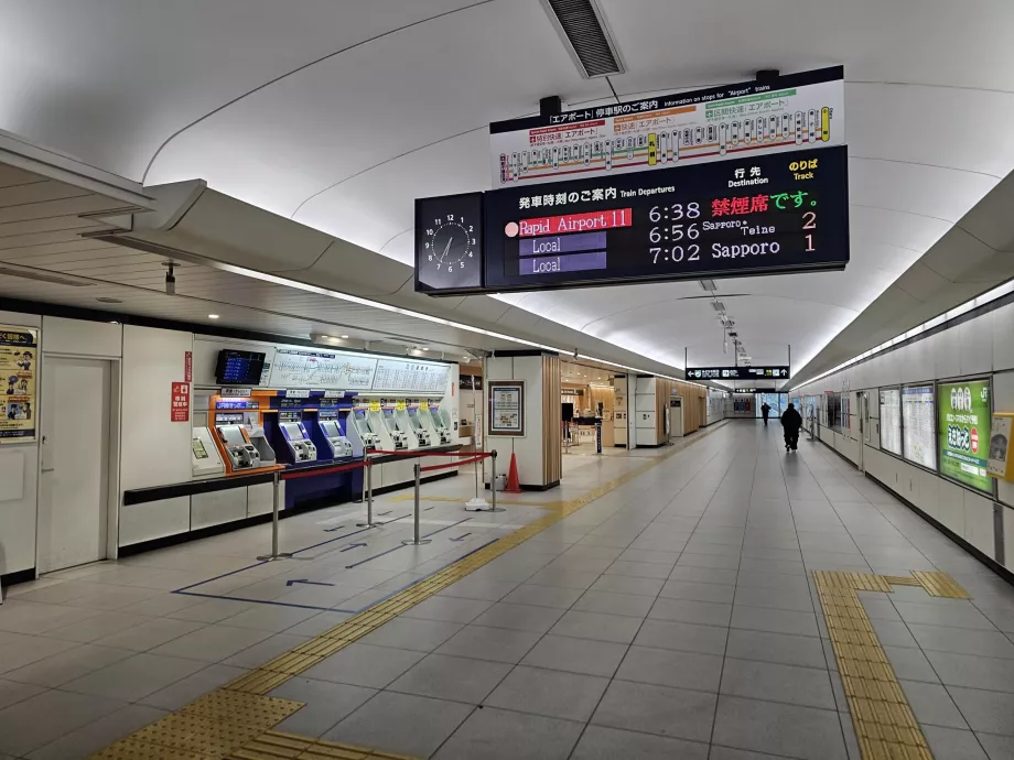 Departure boards and ticket vending machines - train station