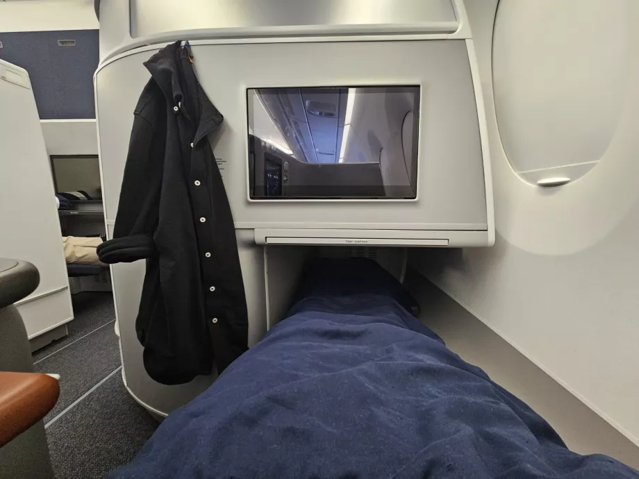 Lying on a fold-out seat