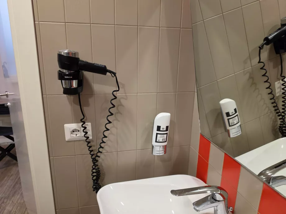 Hair dryer in the bathroom