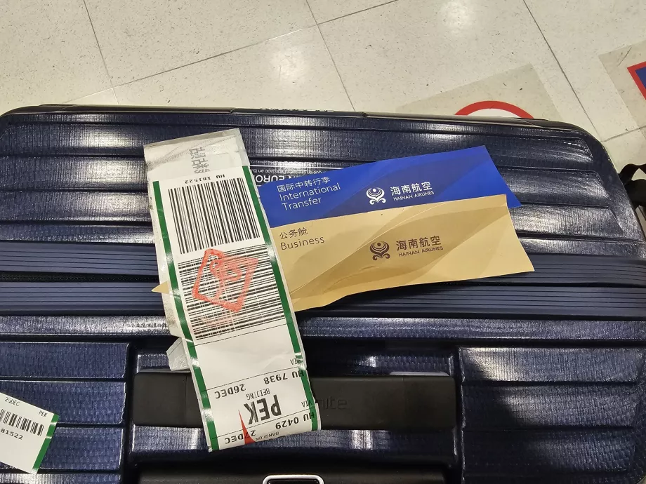 Luggage tag with trasnfer marking