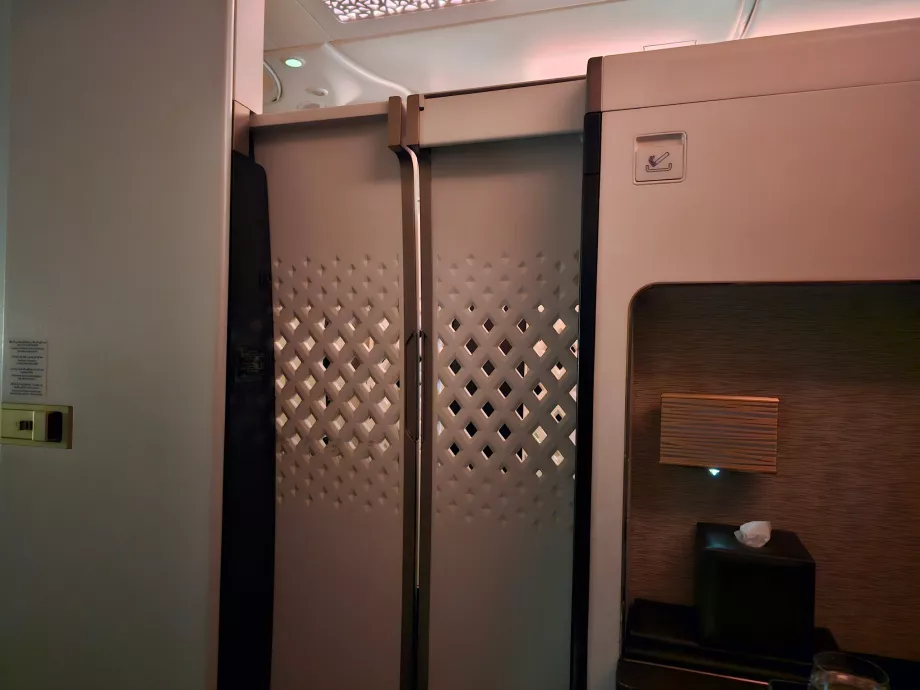 A closed door between the seat and the aisle