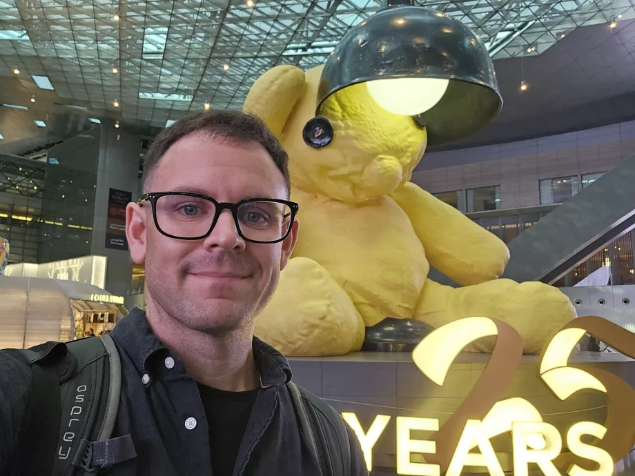 Me in front of a yellow bear with a lamp