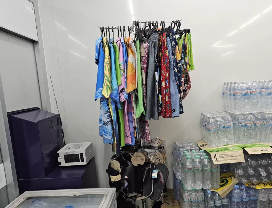 A corner with clothes, swimwear or flip-flops